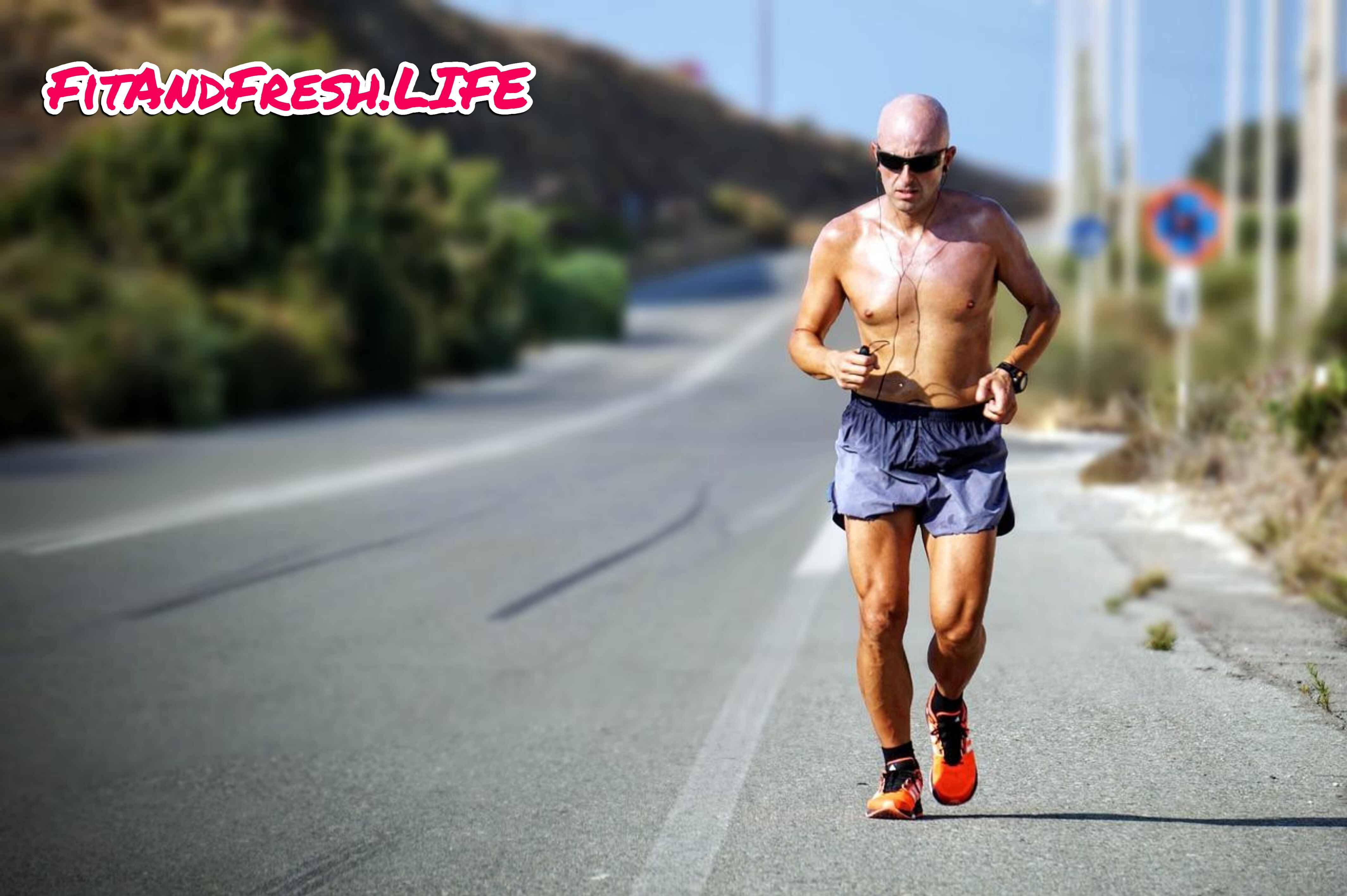 An old motivated man jogging on track